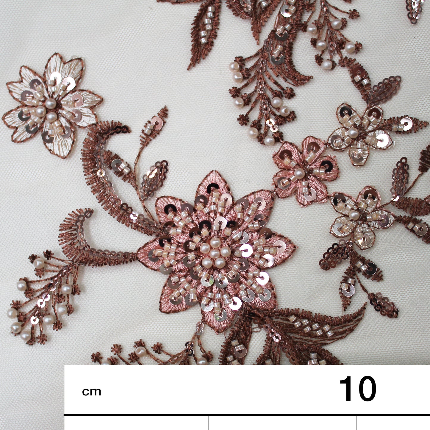 Embroidered Tulle with Star Flowers, Paillettes, Corals, and Beads